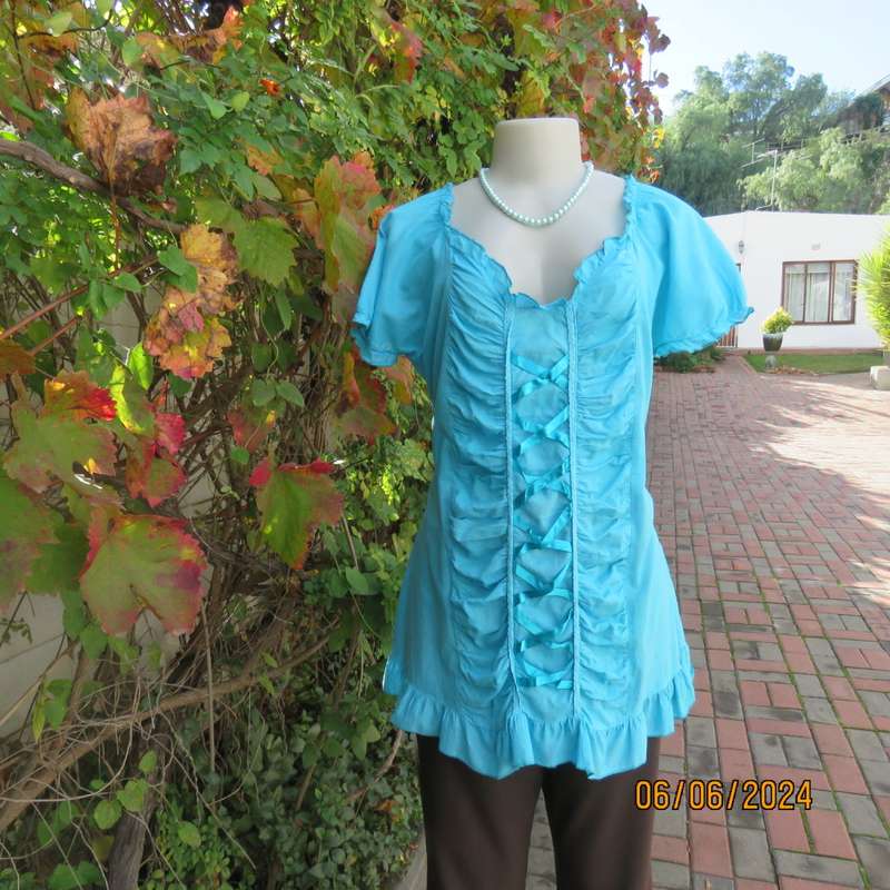 Feminine aquamarine blue peasant style top. Zip at side. Front gathered/decorated panels.Size 42.