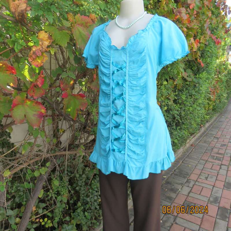 Feminine aquamarine blue peasant style top. Zip at side. Front gathered/decorated panels.Size 42.