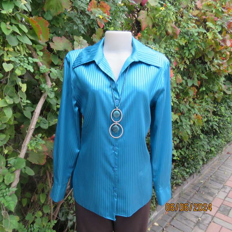 Luxury satin polyester jade long sleeve button down top/open collar. By TLC size 34. Brand new cond.