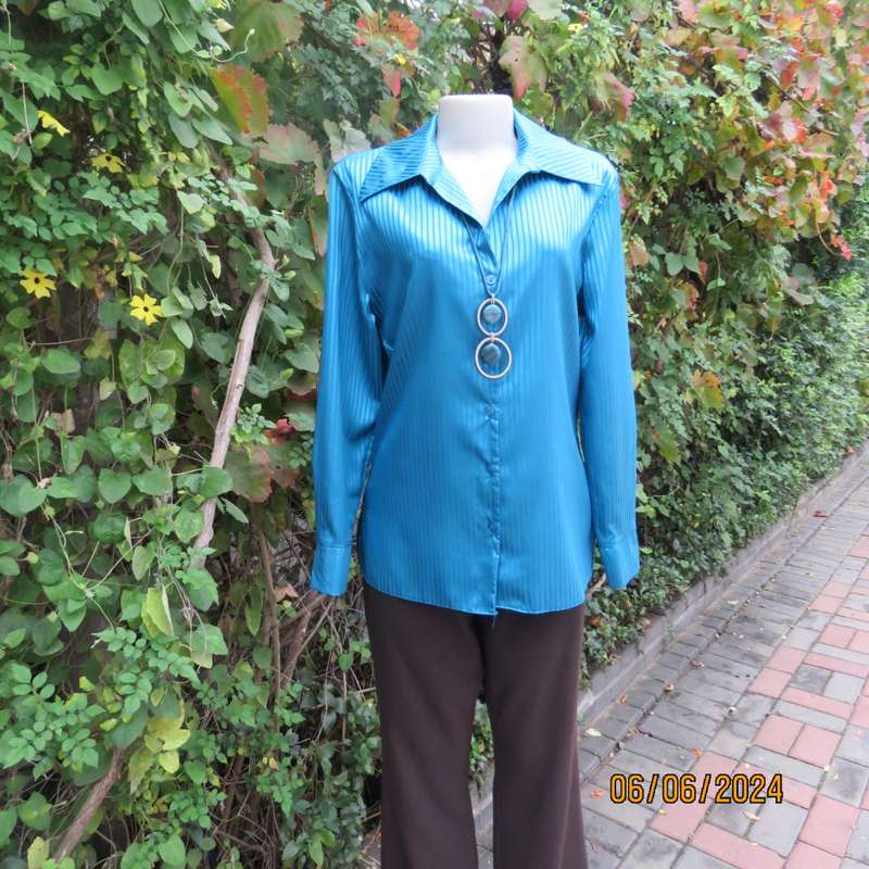 Luxury satin polyester jade long sleeve button down top/open collar. By TLC size 34. Brand new cond.
