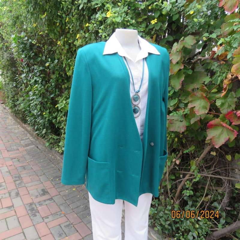 Smart, warm dark green jade polyester knit double breast collerless jacket by WOOLWORTHS size 42.