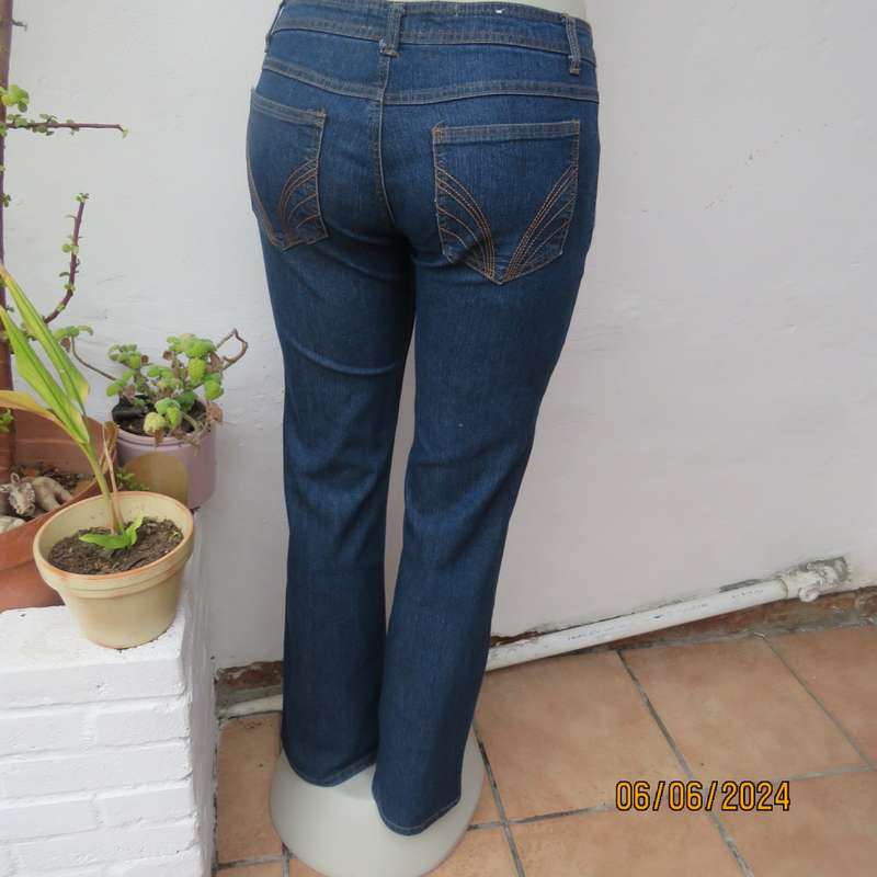 Cute bootcut blue low rise jeans in stretch polycotton. Size 34 by RT. As new.
