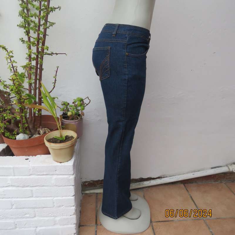 Cute bootcut blue low rise jeans in stretch polycotton. Size 34 by RT. As new.