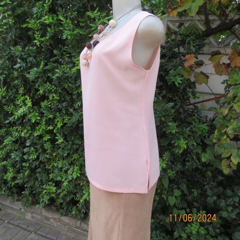 Handy owner made rose pink slip over sleeveless top in came style. Size 34. In 100% polyester.As new