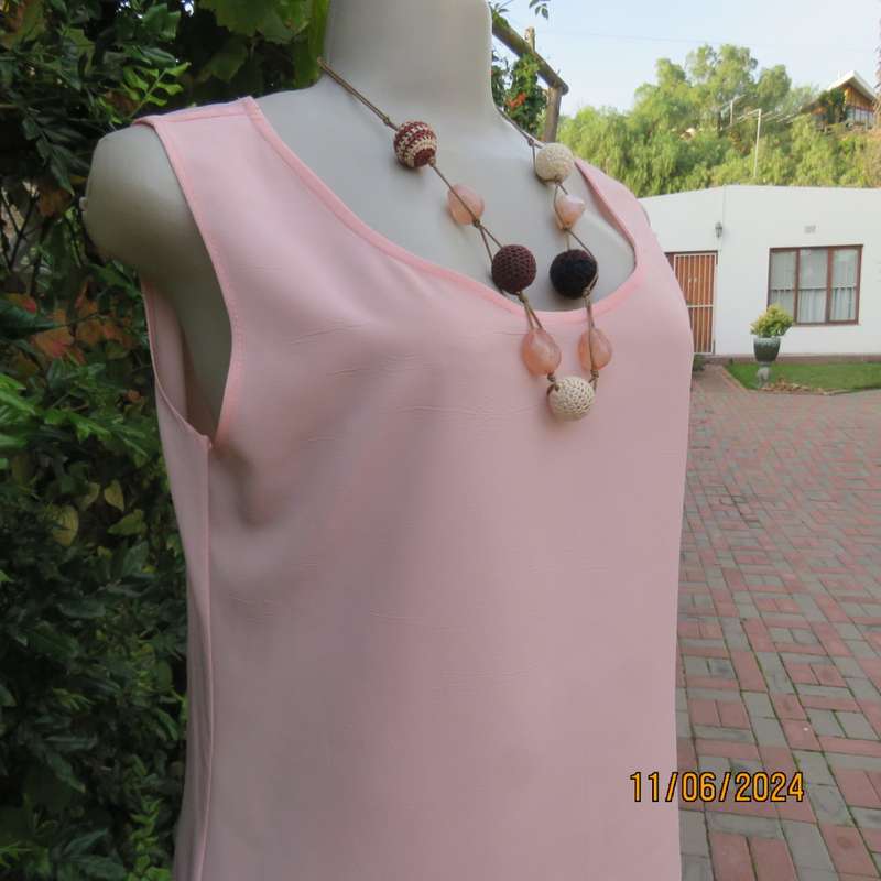 Handy owner made rose pink slip over sleeveless top in came style. Size 34. In 100% polyester.As new