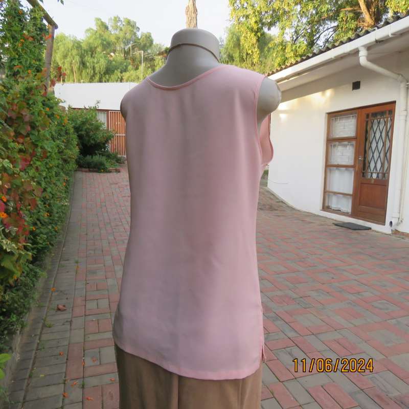Handy owner made rose pink slip over sleeveless top in came style. Size 34. In 100% polyester.As new