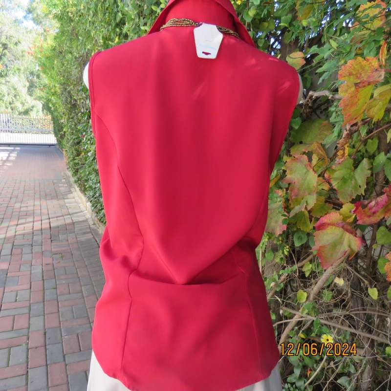 Sweet, red, button down tailored top in silky polyester. Size 36. Open collar. New condition