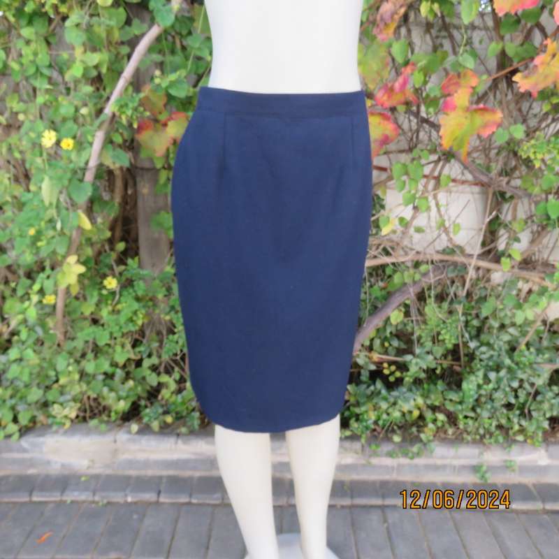 As new dark navy polycotton pencil skirt by BESLIN size 36. Zip and pleat at back.Plain but elegant.