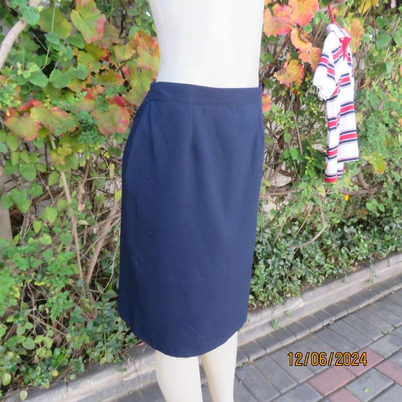 As new dark navy polycotton pencil skirt by BESLIN size 36. Zip and pleat at back.Plain but elegant.