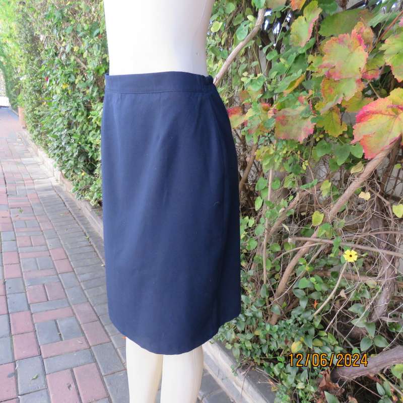 As new dark navy polycotton pencil skirt by BESLIN size 36. Zip and pleat at back.Plain but elegant.