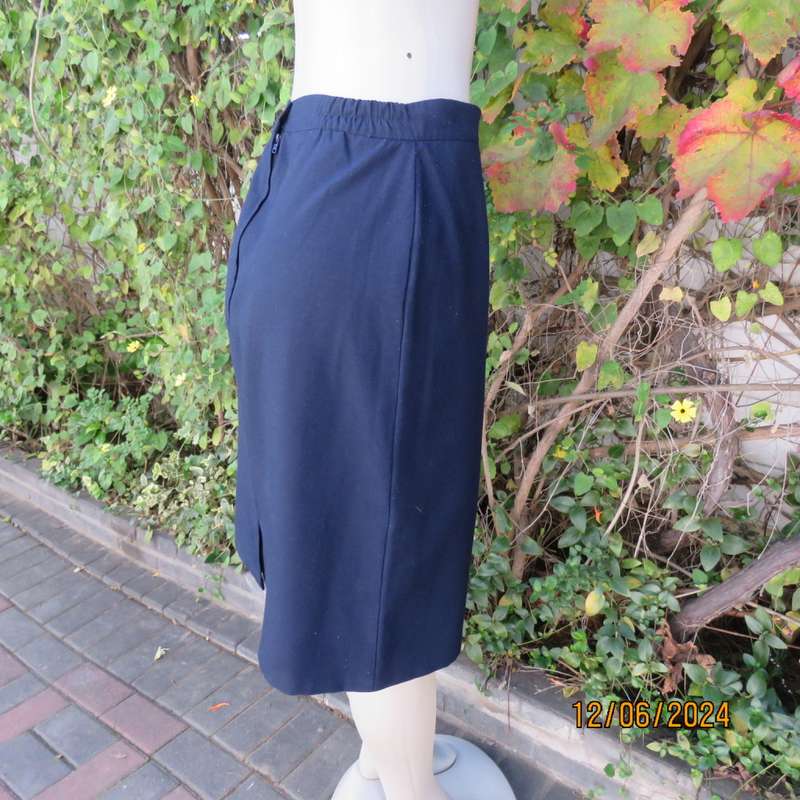 As new dark navy polycotton pencil skirt by BESLIN size 36. Zip and pleat at back.Plain but elegant.