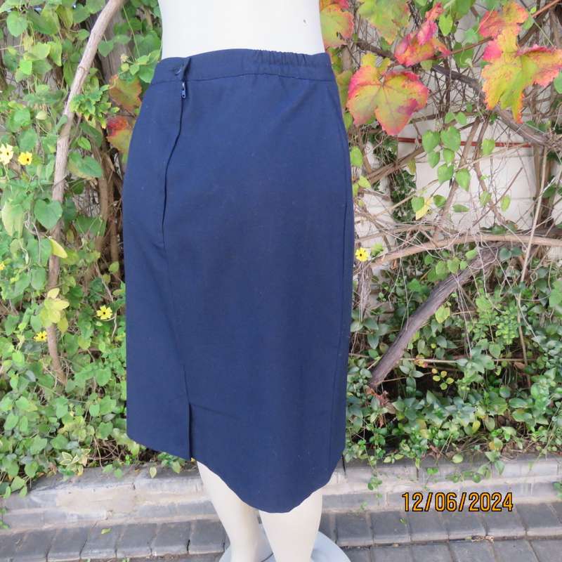 As new dark navy polycotton pencil skirt by BESLIN size 36. Zip and pleat at back.Plain but elegant.