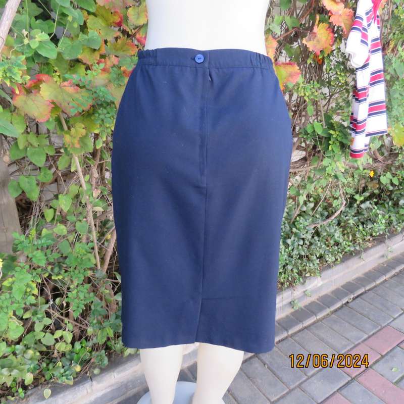 As new dark navy polycotton pencil skirt by BESLIN size 36. Zip and pleat at back.Plain but elegant.
