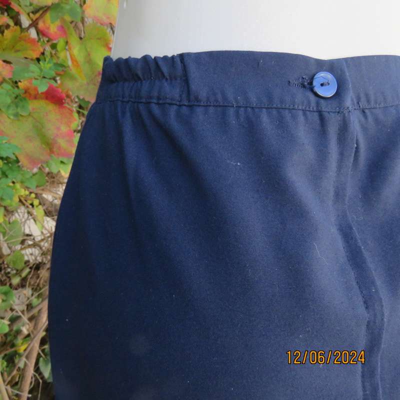 As new dark navy polycotton pencil skirt by BESLIN size 36. Zip and pleat at back.Plain but elegant.