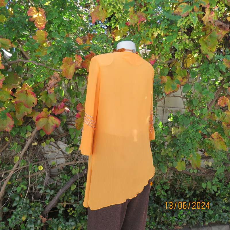 Eye catching tangerine crinkled polyester slip over top with high/low seamline.Size 38. New cond.