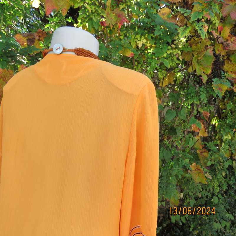 Eye catching tangerine crinkled polyester slip over top with high/low seamline.Size 38. New cond.