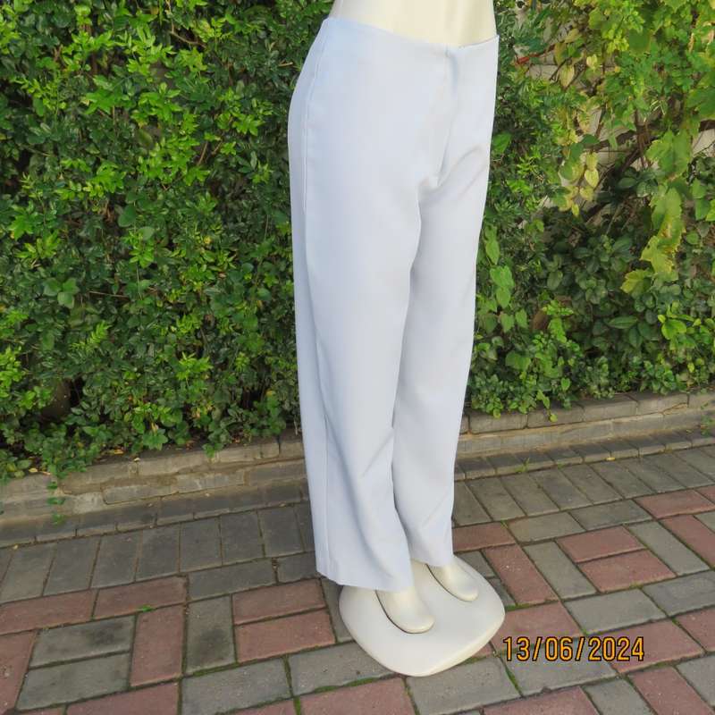 Bandless carolina blue straight legged dress pants in 100% polyester. Size 36 by SMILEY. As new