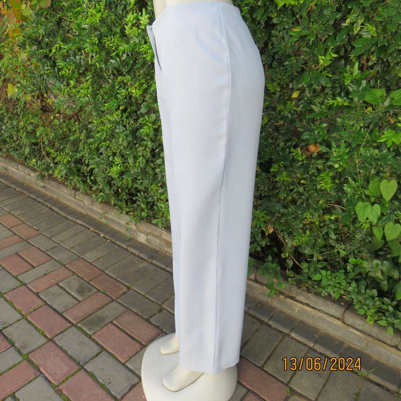 Bandless carolina blue straight legged dress pants in 100% polyester. Size 36 by SMILEY. As new
