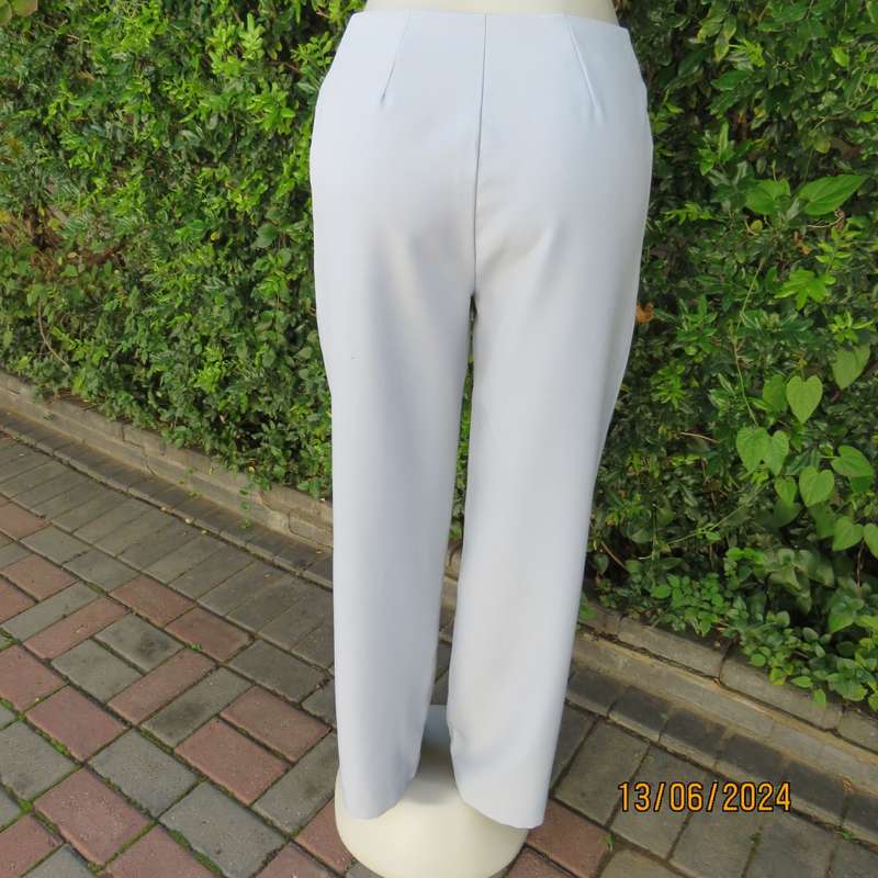 Bandless carolina blue straight legged dress pants in 100% polyester. Size 36 by SMILEY. As new