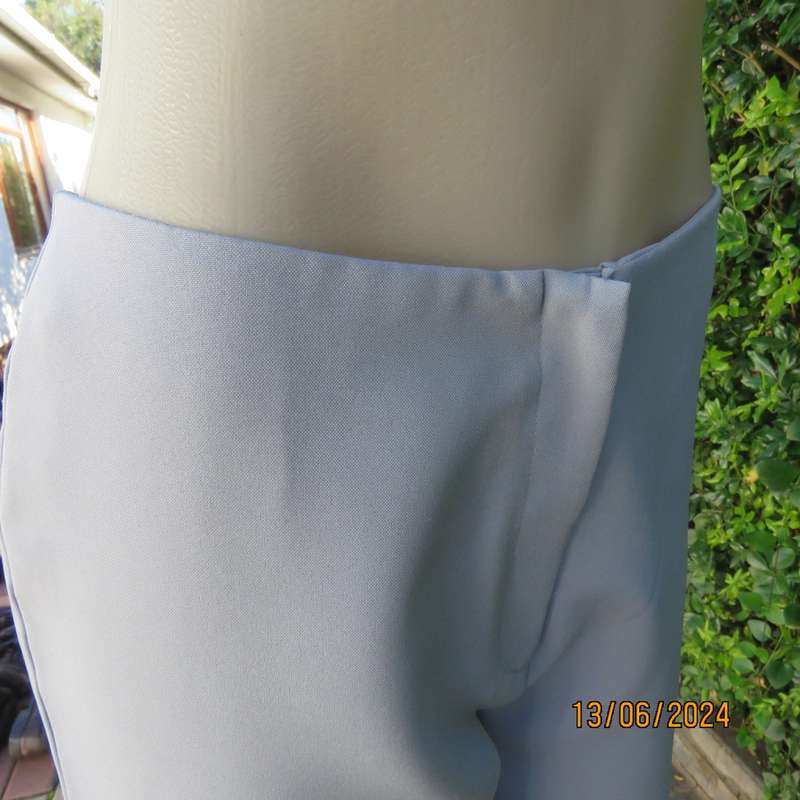 Bandless carolina blue straight legged dress pants in 100% polyester. Size 36 by SMILEY. As new