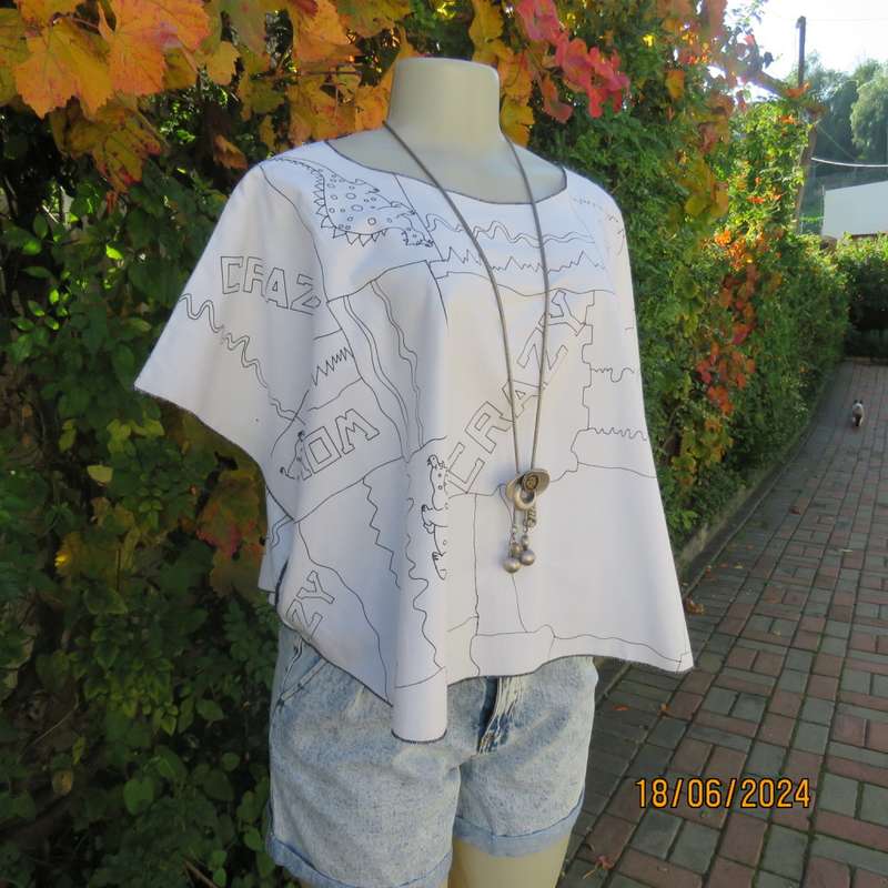 Unique white halfmoon polycotton top with black dragons/logos.Slip over. Free size. As new