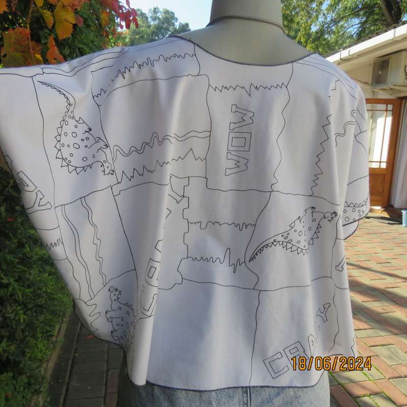Unique white halfmoon polycotton top with black dragons/logos.Slip over. Free size. As new