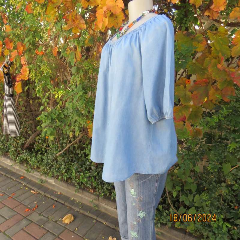 Stunning blue denim slip over short sleeve top. Wide elasticated neckline. By BE YOURSELF.Size 42/44