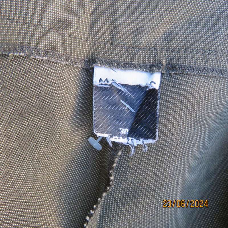 Mottled olive green ankle length pants by MERIEN HALL size 38. Slits at outer leg seams. As new
