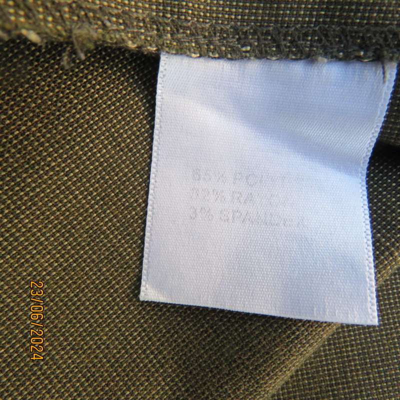 Mottled olive green ankle length pants by MERIEN HALL size 38. Slits at outer leg seams. As new