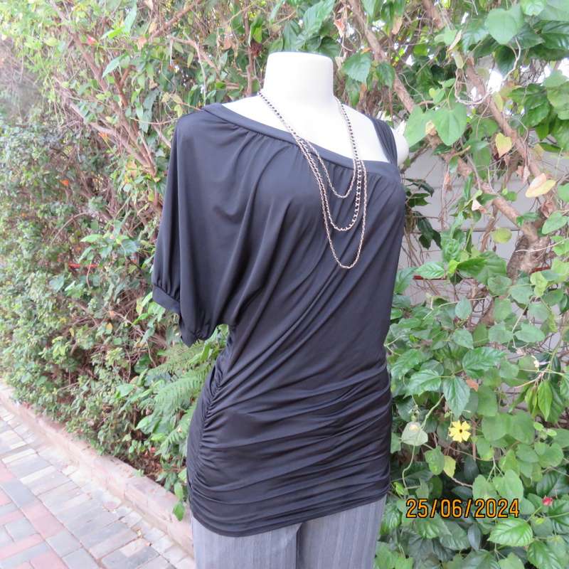 Amazing black poly stretch long top. One short cut-on sleeve/and 3 thin shoulder straps.Size 36 WWW