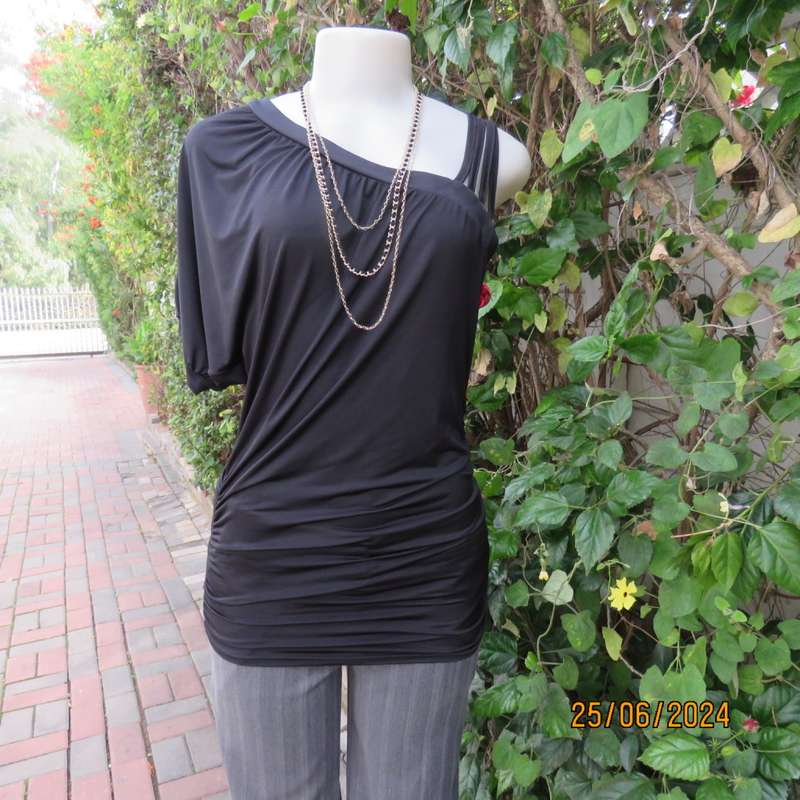 Amazing black poly stretch long top. One short cut-on sleeve/and 3 thin shoulder straps.Size 36 WWW