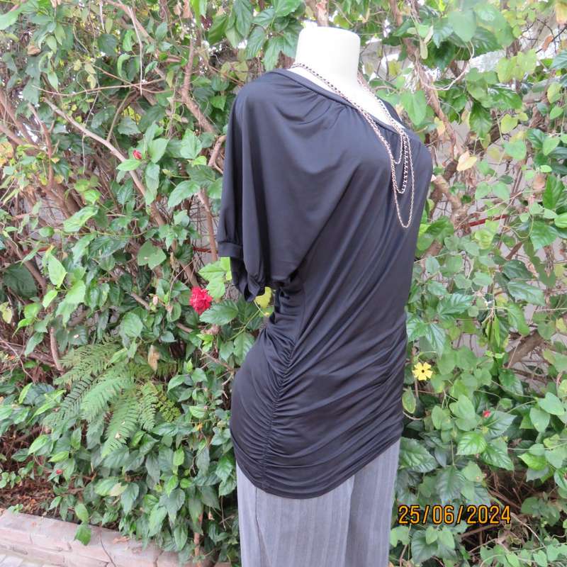 Amazing black poly stretch long top. One short cut-on sleeve/and 3 thin shoulder straps.Size 36 WWW