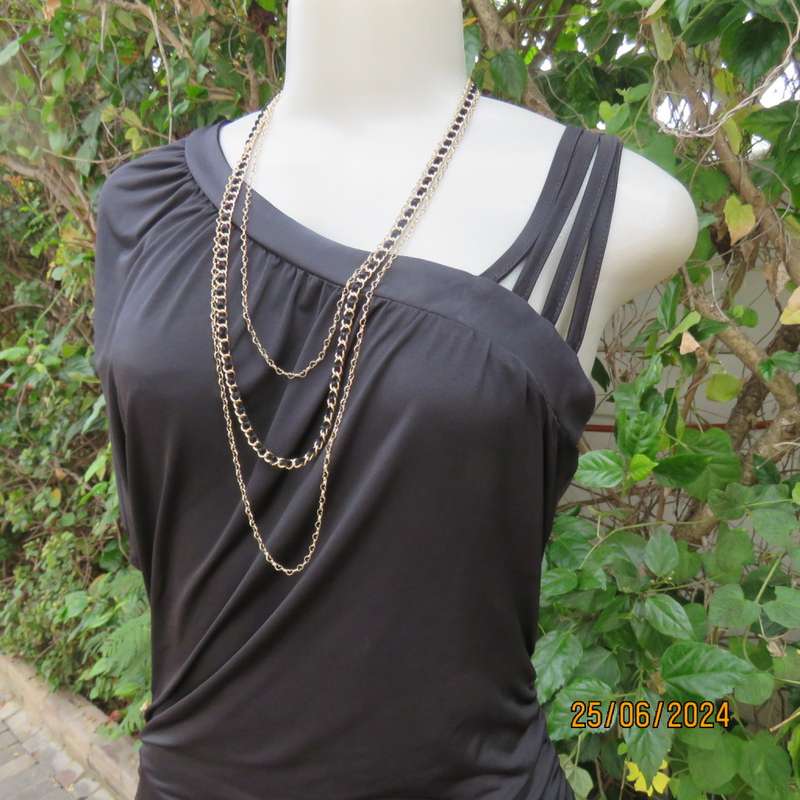 Amazing black poly stretch long top. One short cut-on sleeve/and 3 thin shoulder straps.Size 36 WWW