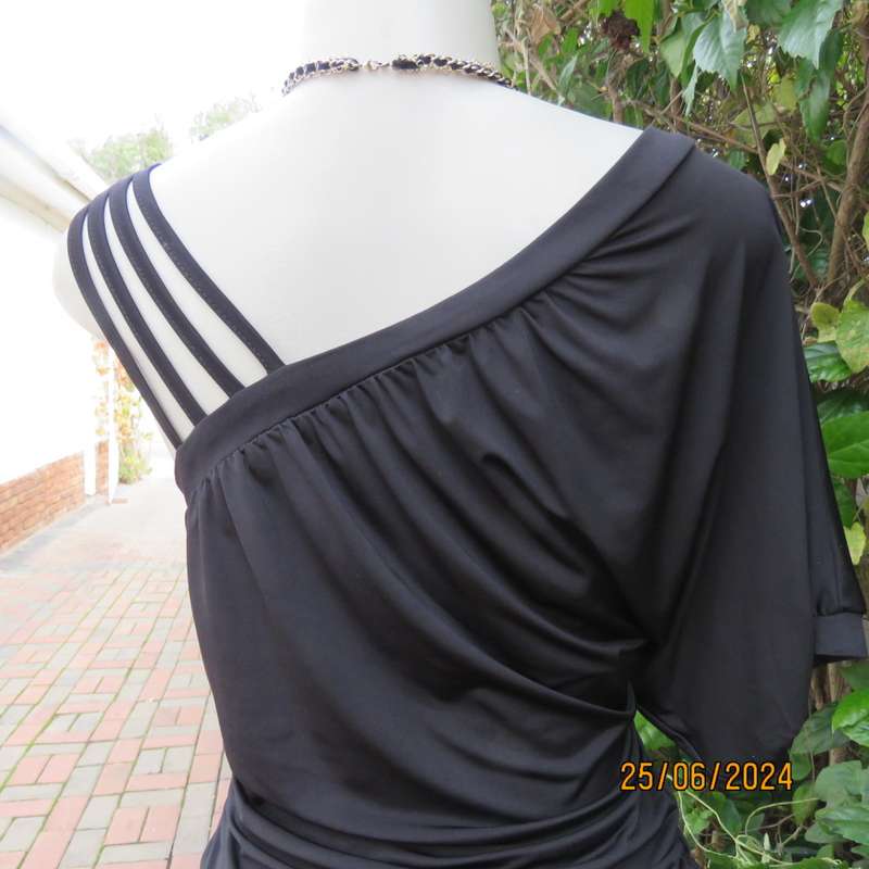 Amazing black poly stretch long top. One short cut-on sleeve/and 3 thin shoulder straps.Size 36 WWW