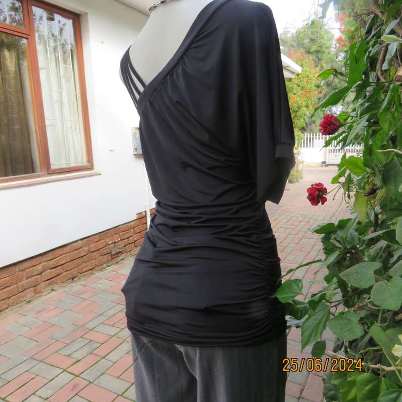 Amazing black poly stretch long top. One short cut-on sleeve/and 3 thin shoulder straps.Size 36 WWW