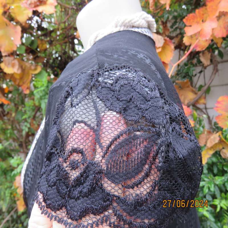 Handy crossover sheer polyester black bolero. Long straps to tie, Tiny lace capped sleeves. Size 38