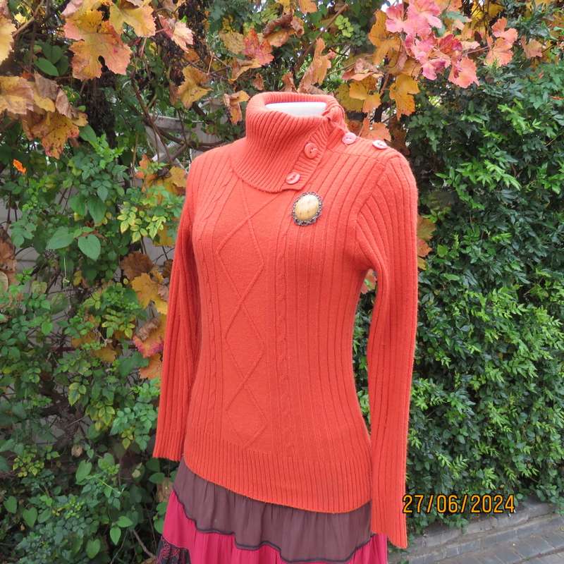 Burnt orange long sleeve poloneck sweater, size 34. Rayon/acrylic knit.