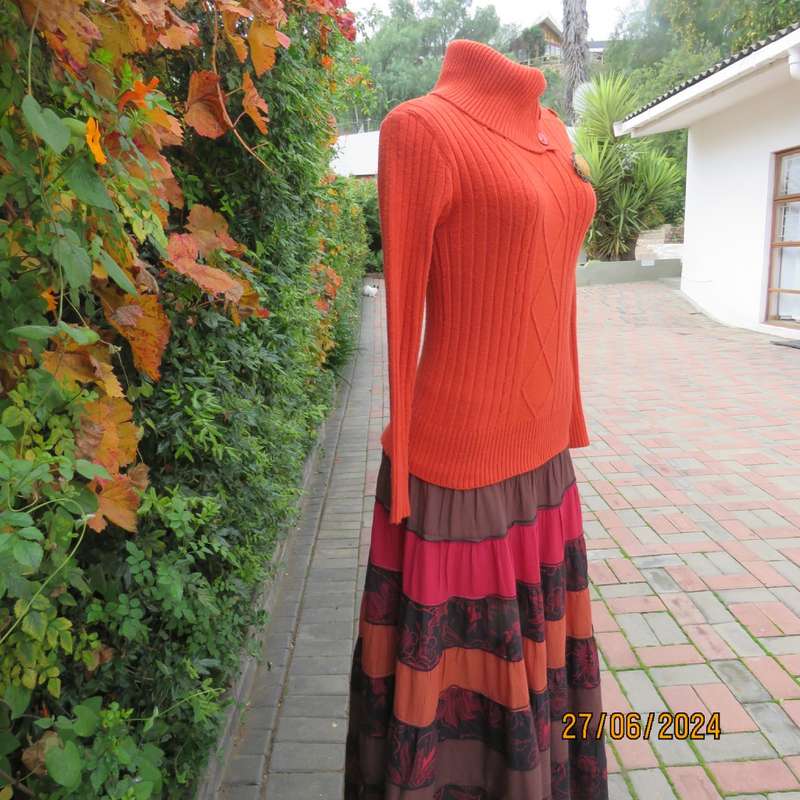 Burnt orange long sleeve poloneck sweater, size 34. Rayon/acrylic knit.