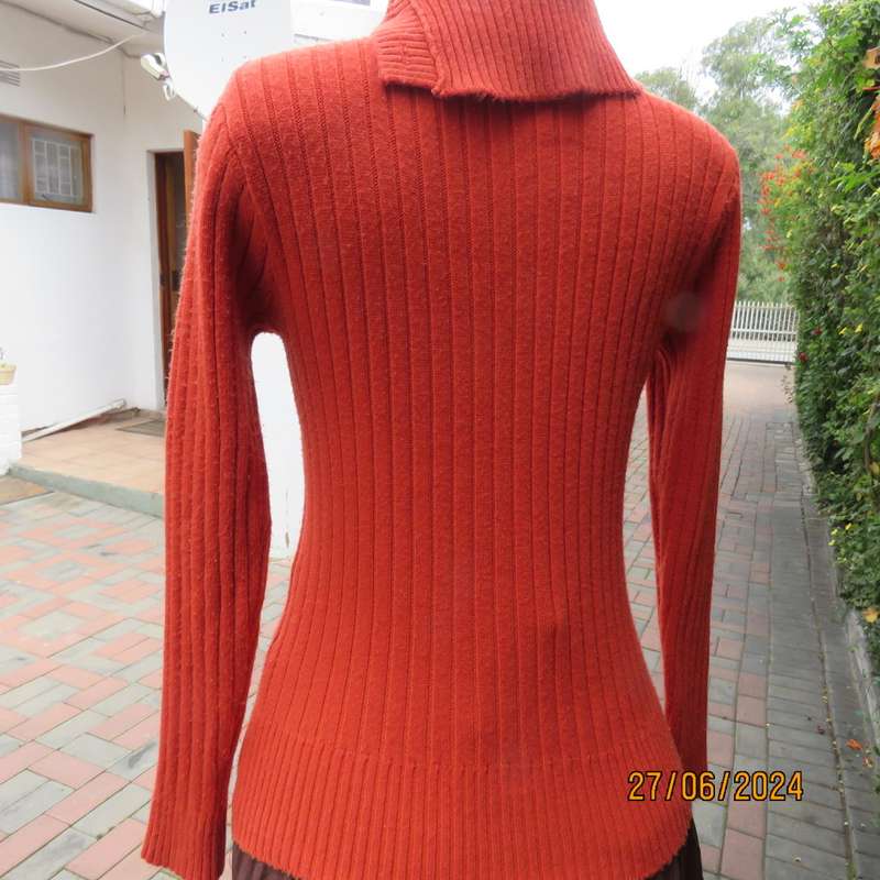 Burnt orange long sleeve poloneck sweater, size 34. Rayon/acrylic knit.