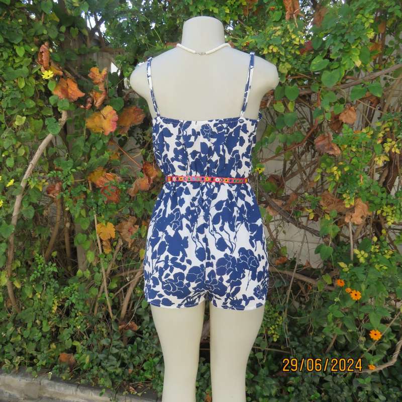 Summer romper in white with bold navy flowers. Elasticated waist. Size 36 by SHEIN. Brand new cond.