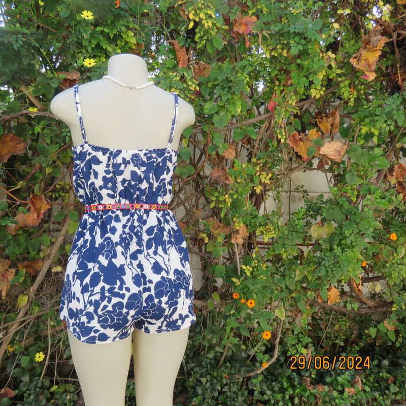 Summer romper in white with bold navy flowers. Elasticated waist. Size 36 by SHEIN. Brand new cond.