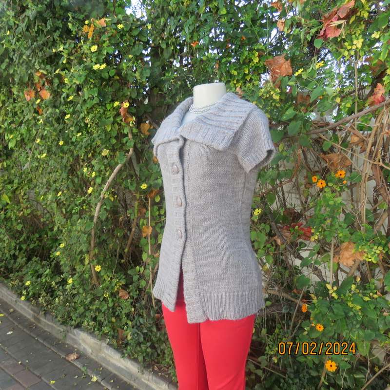 Double knit grey acrylic cardigan. Capped sleeves, button down with wide fold over collar.Size 36.