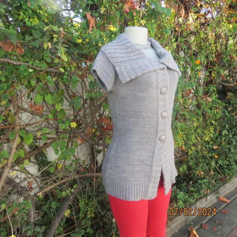 Double knit grey acrylic cardigan. Capped sleeves, button down with wide fold over collar.Size 36.