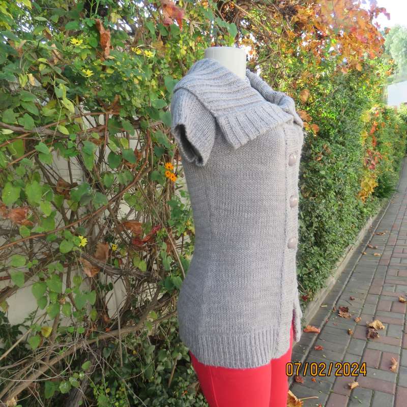 Double knit grey acrylic cardigan. Capped sleeves, button down with wide fold over collar.Size 36.
