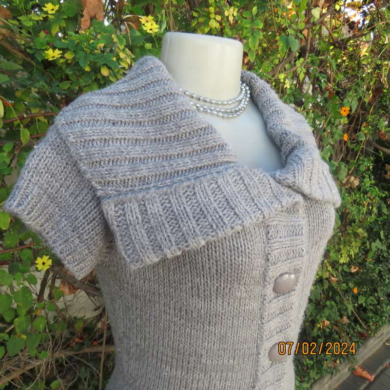 Double knit grey acrylic cardigan. Capped sleeves, button down with wide fold over collar.Size 36.