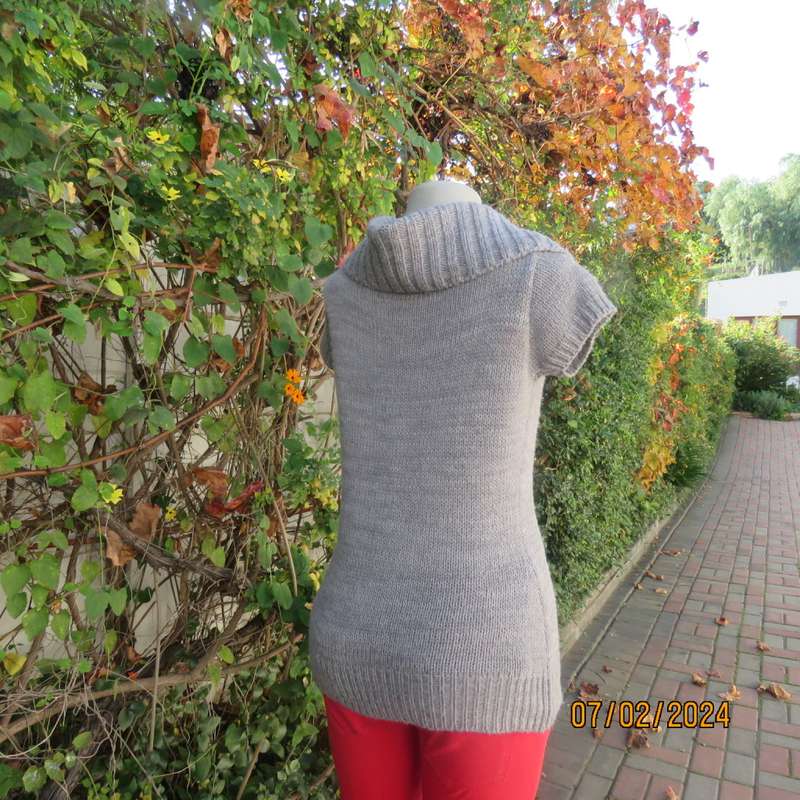 Double knit grey acrylic cardigan. Capped sleeves, button down with wide fold over collar.Size 36.
