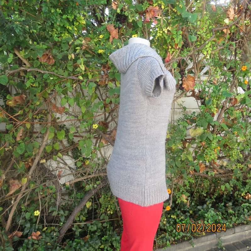 Double knit grey acrylic cardigan. Capped sleeves, button down with wide fold over collar.Size 36.