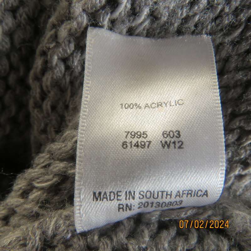 Double knit grey acrylic cardigan. Capped sleeves, button down with wide fold over collar.Size 36.