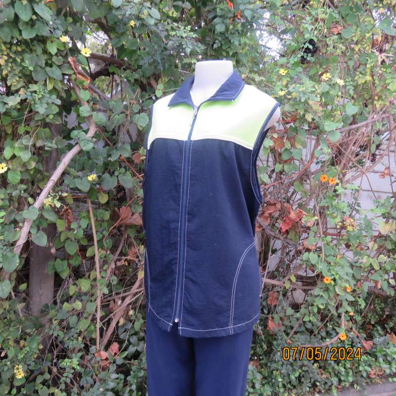 Navy nylon sleeveless zip-up nylon top with lime green front polycotton yoke.Size 42 by ML Classics