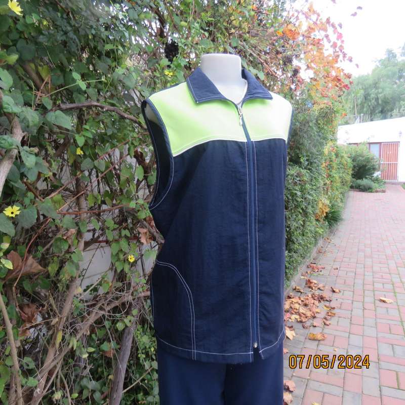 Navy nylon sleeveless zip-up nylon top with lime green front polycotton yoke.Size 42 by ML Classics